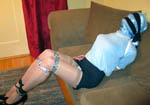 trannie Sandra fully hooded, gagged, blindfolded, and taped into bondage
