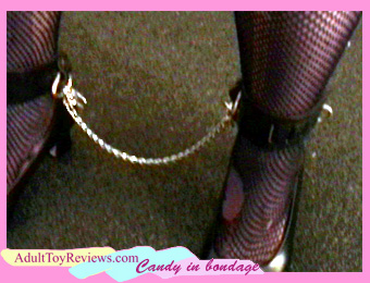 Candy in bondage: high heels, ankle cuffs, and short chain