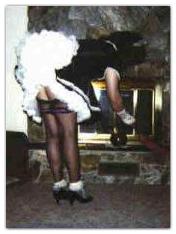 Sissy Maid Suzie cleans the fireplace