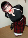 office trannie tightly rope bound with strapped-in ball-gag