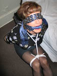 trannie in blindfold, cleave gag, and rope bondage